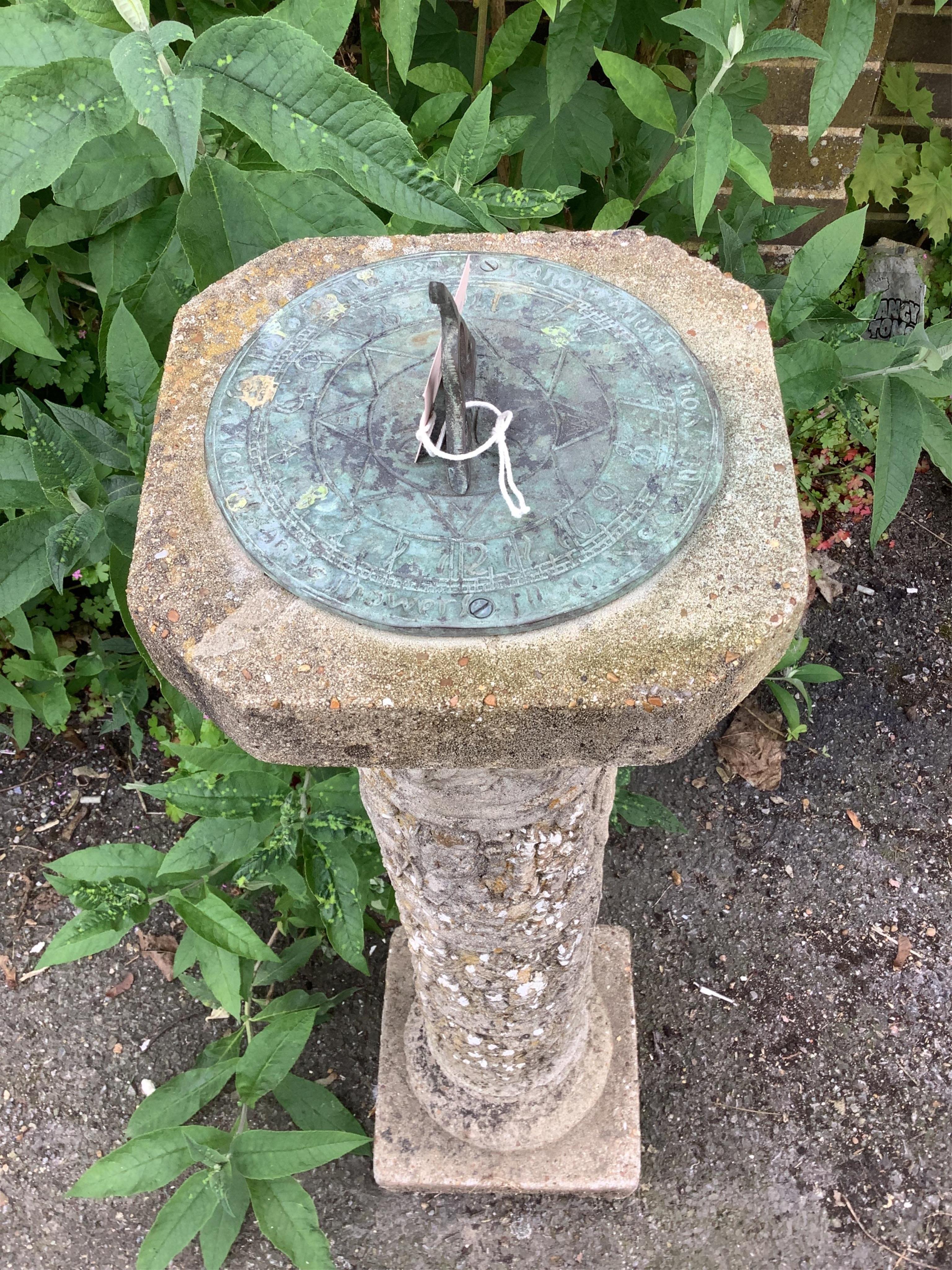 A reconstituted stone and cast metal sundial, height 92cm